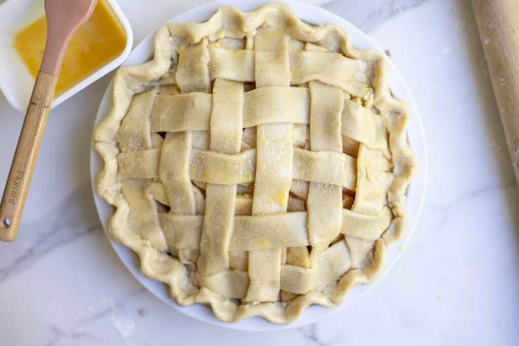 apple pie brushed with an egg wash and topped with sugar.