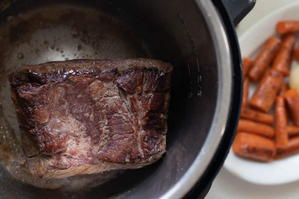 A seared chuck roast in the Instant Pot.