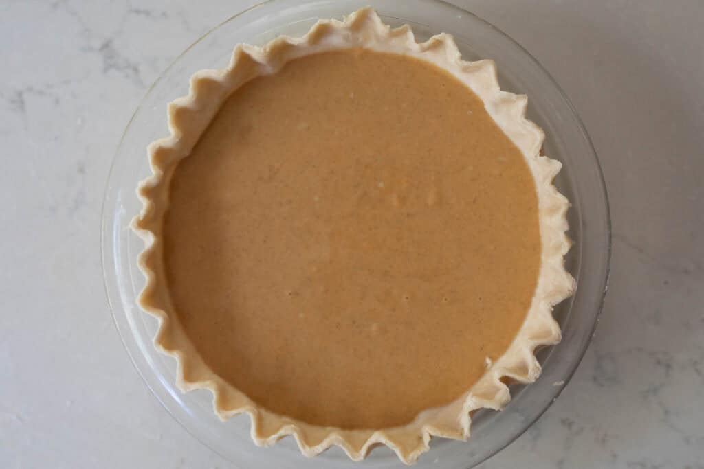 Pumpkin pie ready for the oven. 