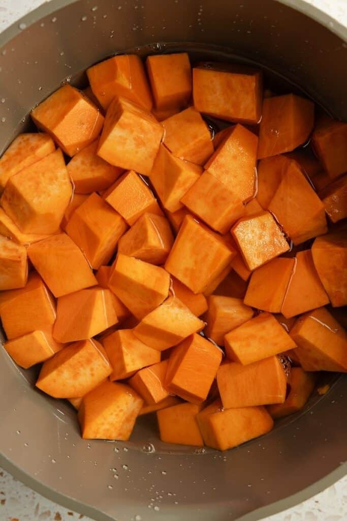 Cubed sweet potatoes in a large pot. 