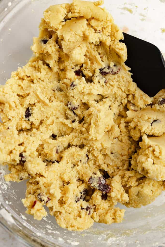 Cranberry cookie dough mixed together in a bowl.