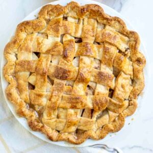 A golden brown pie on a white countertop.