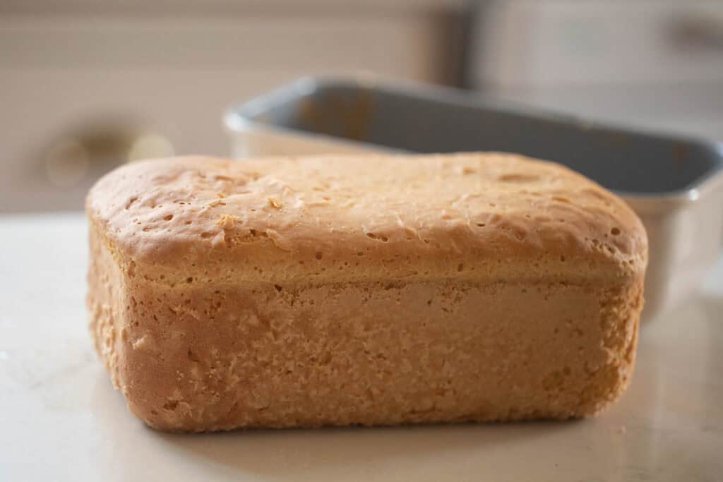 A loaf of einkorn sandwich bread on a countertop.