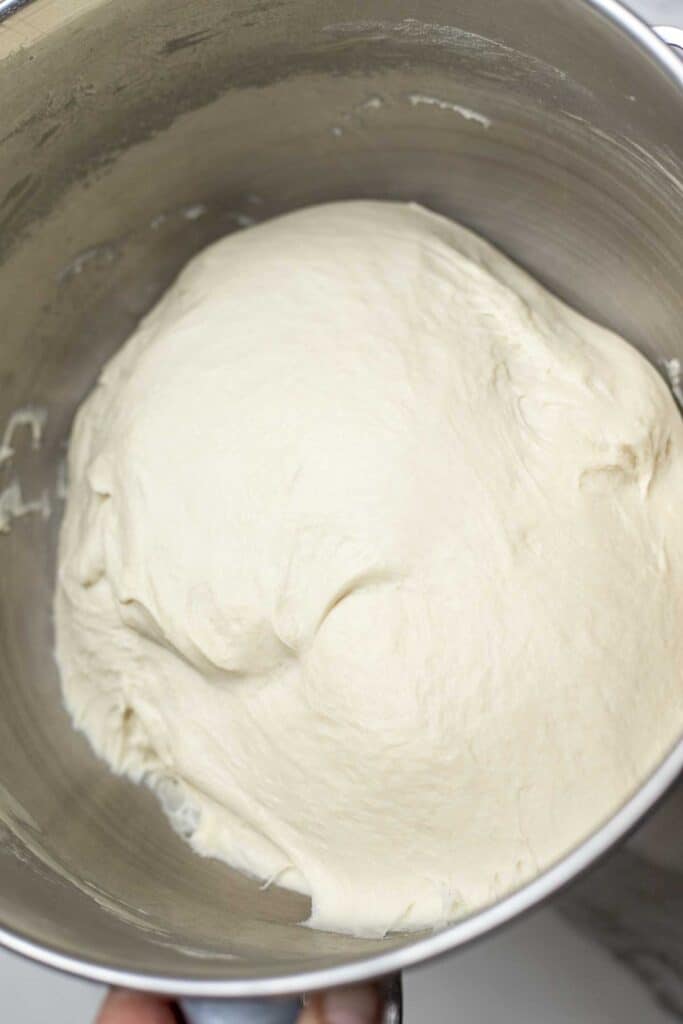 sourdough bread dough in a metal bowl.