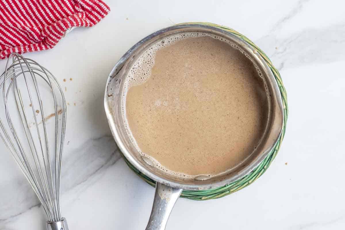 peppermint mocha ingredients mixed together in a sauce pan. 