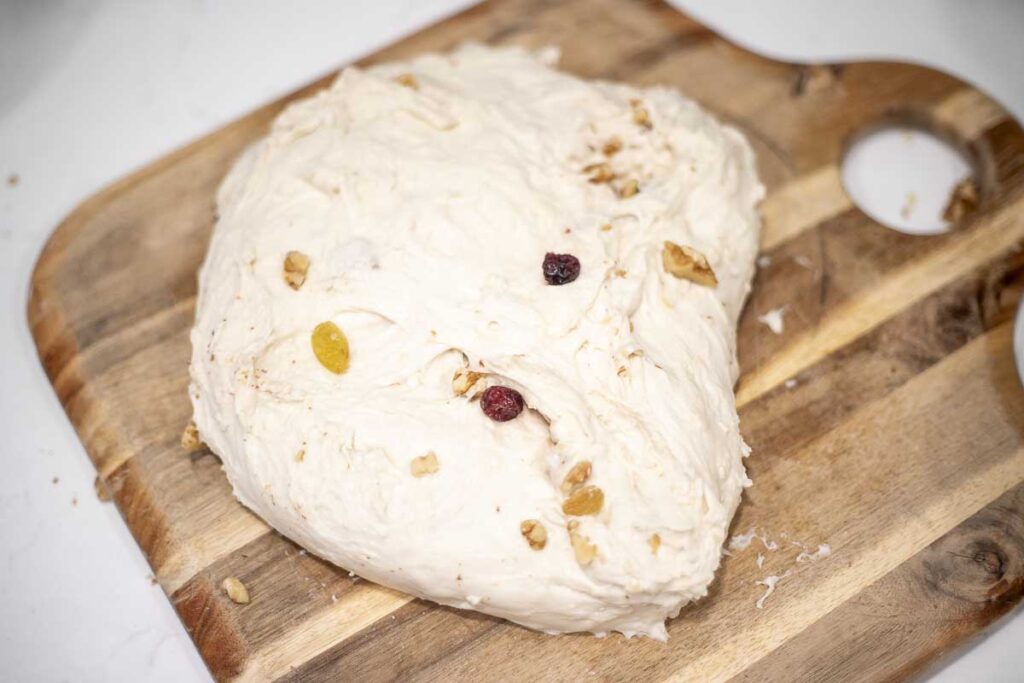 Incorporating fruit and nuts into dough.