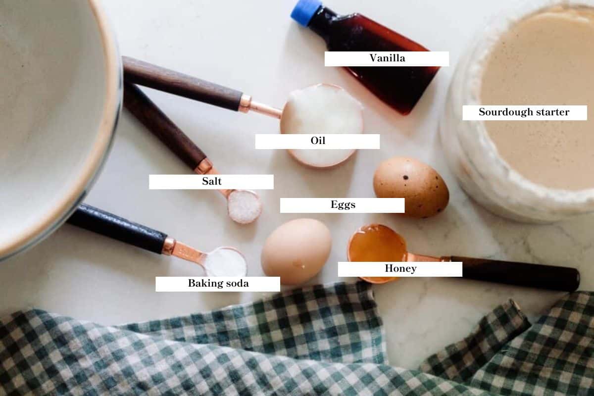 Ingredients of sourdough waffles laid out on a countertop.