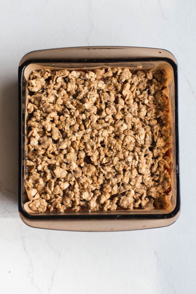 The topping added to the date squares in a square baking pan. 