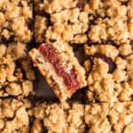 A pan of date squares cut with one popping out.