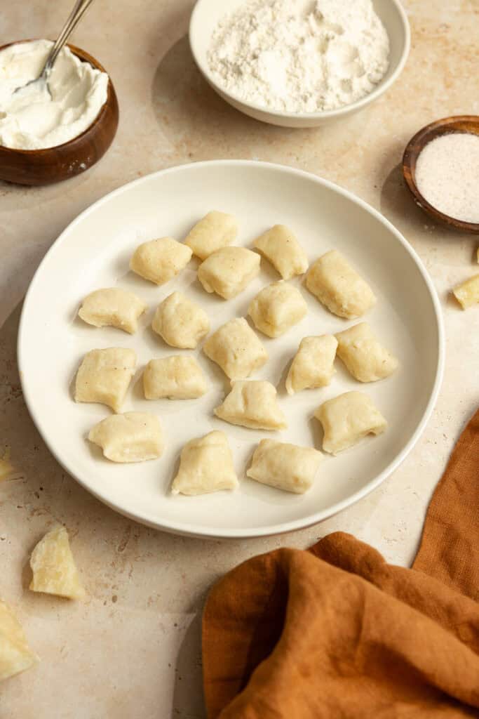 A plate of cooked gnocchi.