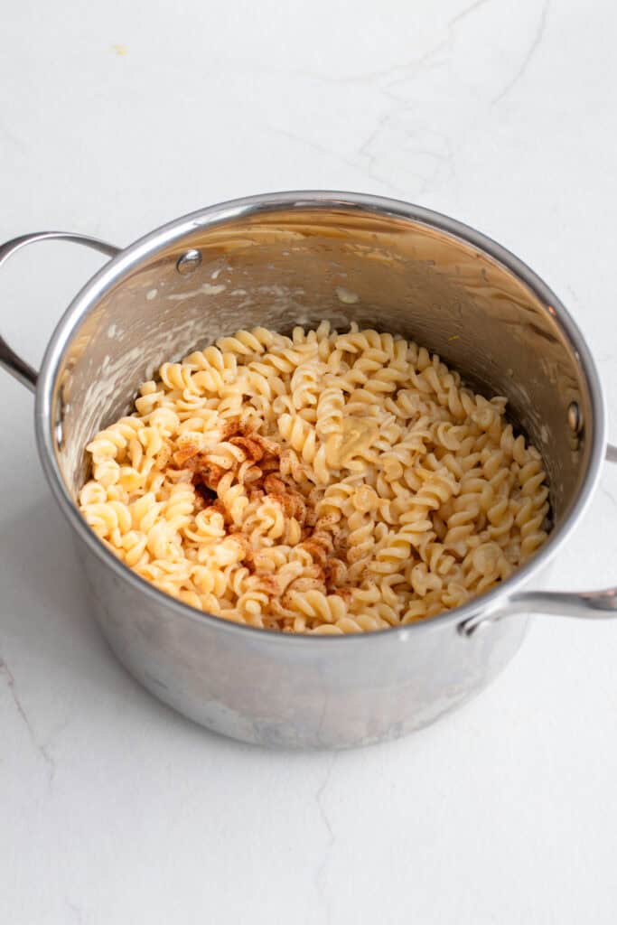 A large pot of pasta with cheese.