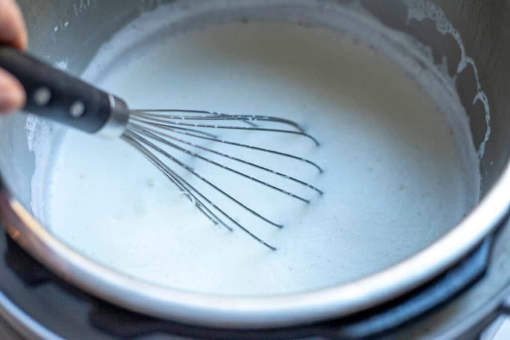 Milk whisked in an Instant Pot.