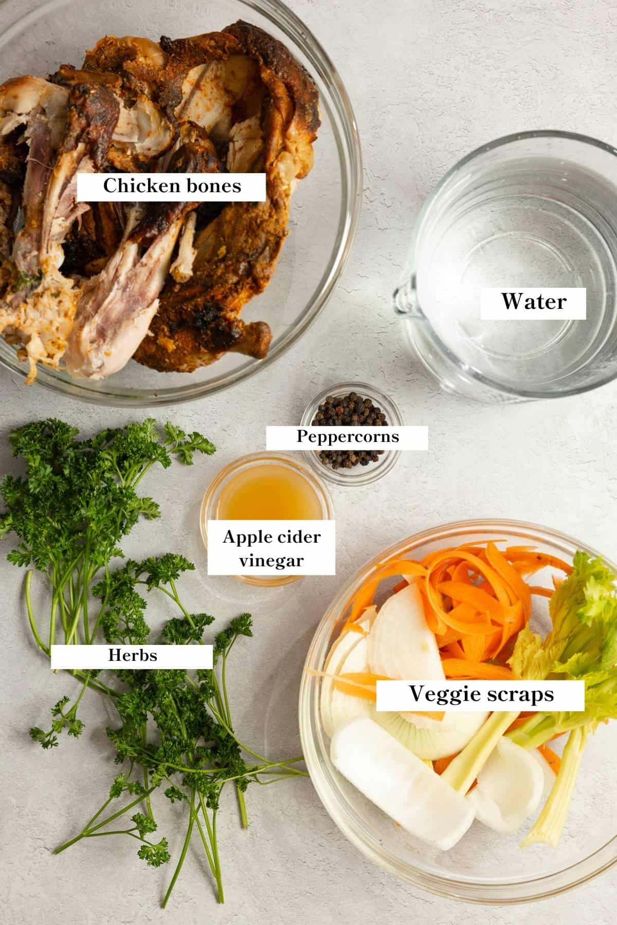 Ingredients for chicken bone broth on a counter.