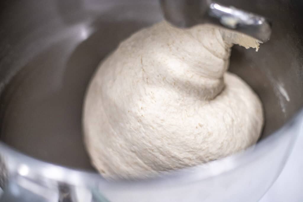 bread dough kneaded enough in a stand mixer with a dough hook attachment.