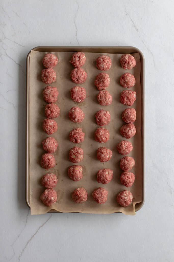 Meatballs on a baking sheet.