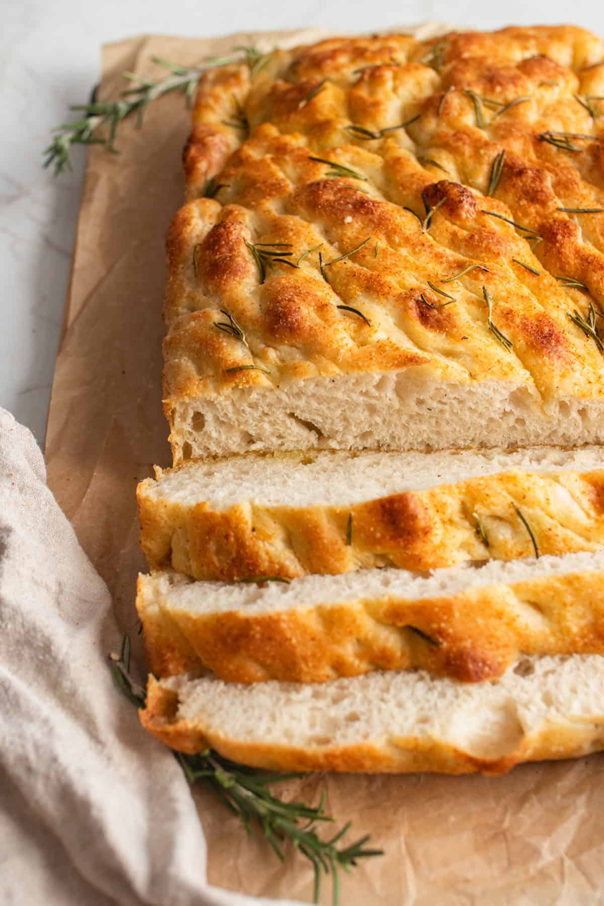 A loaf of focaccia sliced.