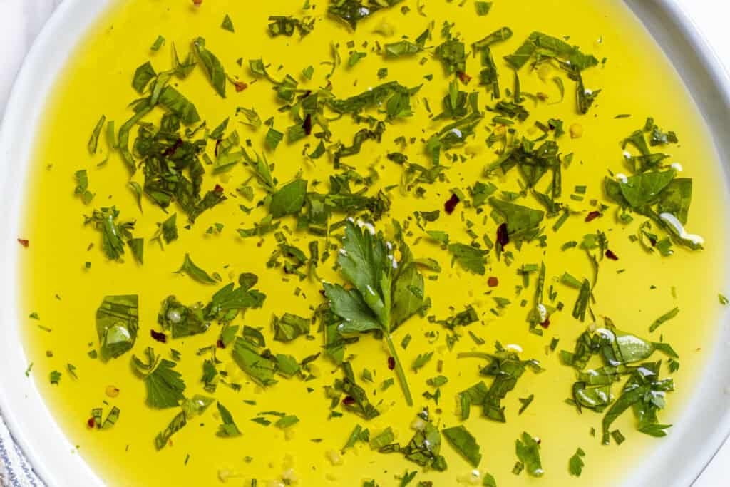 Herbs in a bowl of oil. 