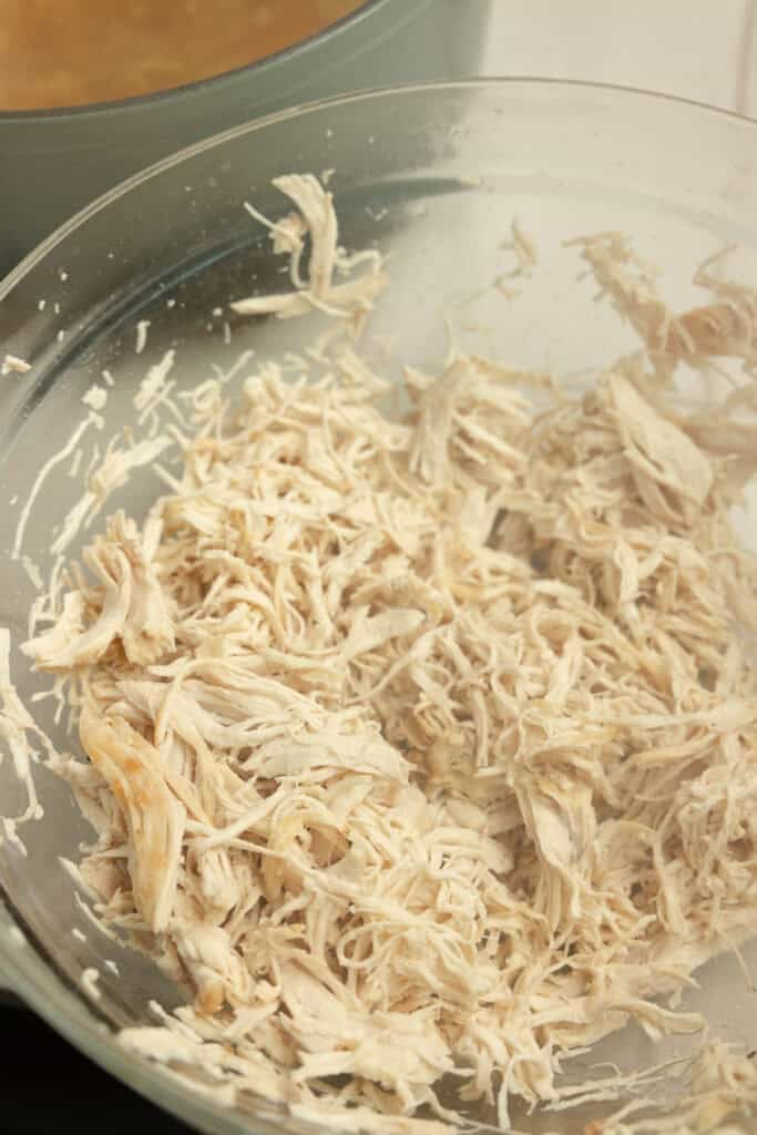 Chicken shredded in a bowl. 