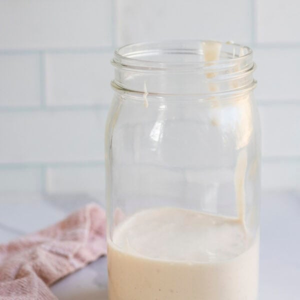 A large mason jar with discard in it about halfway to the top.